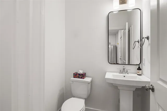 a front view of a building with parking