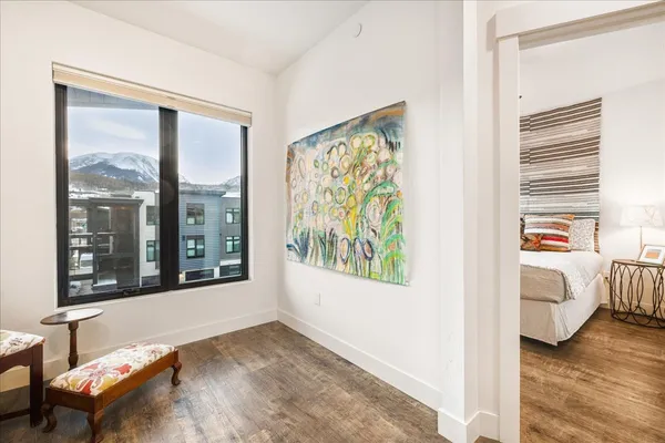 a view of a bedroom with furniture and windows