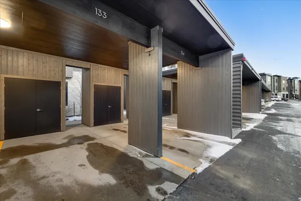a view of a hallway with wooden walls