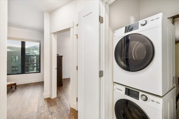 a view of a hallway with washer and dryer