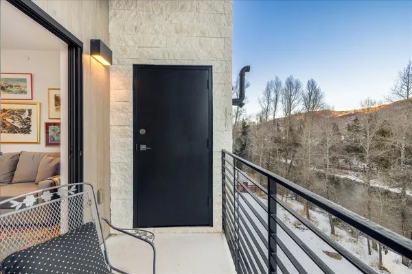 a view of a balcony with furniture