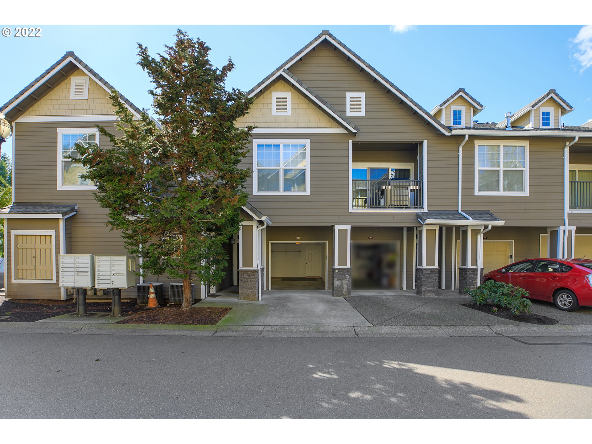 595 Springtree Lane West Linn, OR 97068 - Photo 2 of 28 a front view of a house with a yard and garage