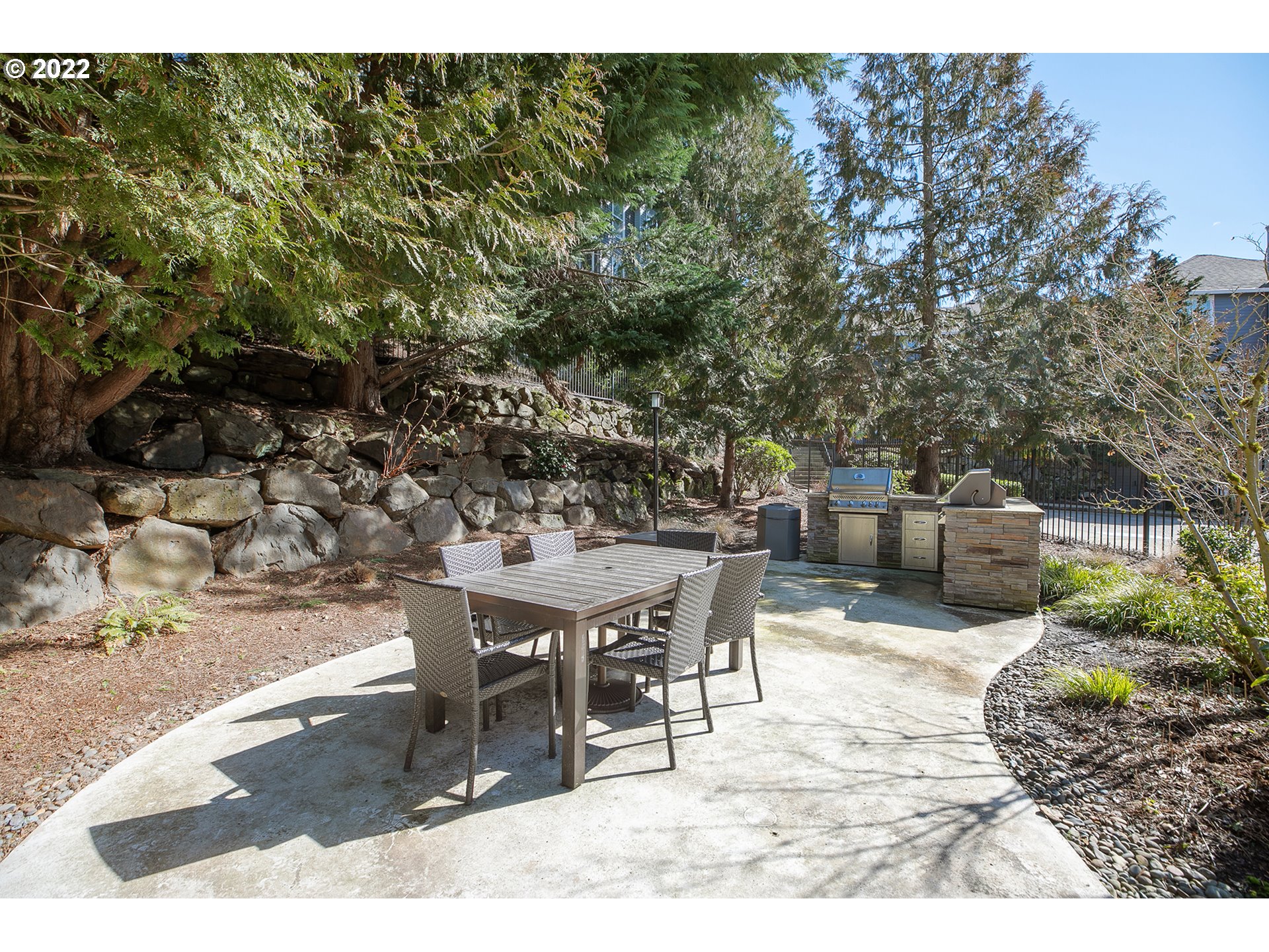 595 Springtree Lane West Linn, OR 97068 - Photo 24 of 28 a patio with table and chairs and potted plants