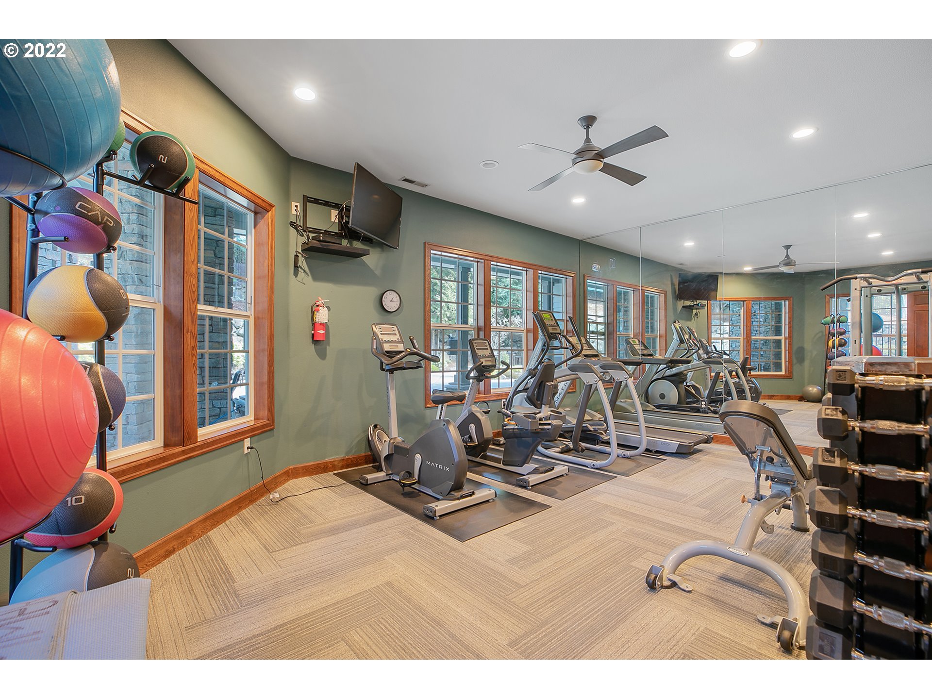595 Springtree Lane West Linn, OR 97068 - Photo 25 of 28 a room with gym equipment and a large window