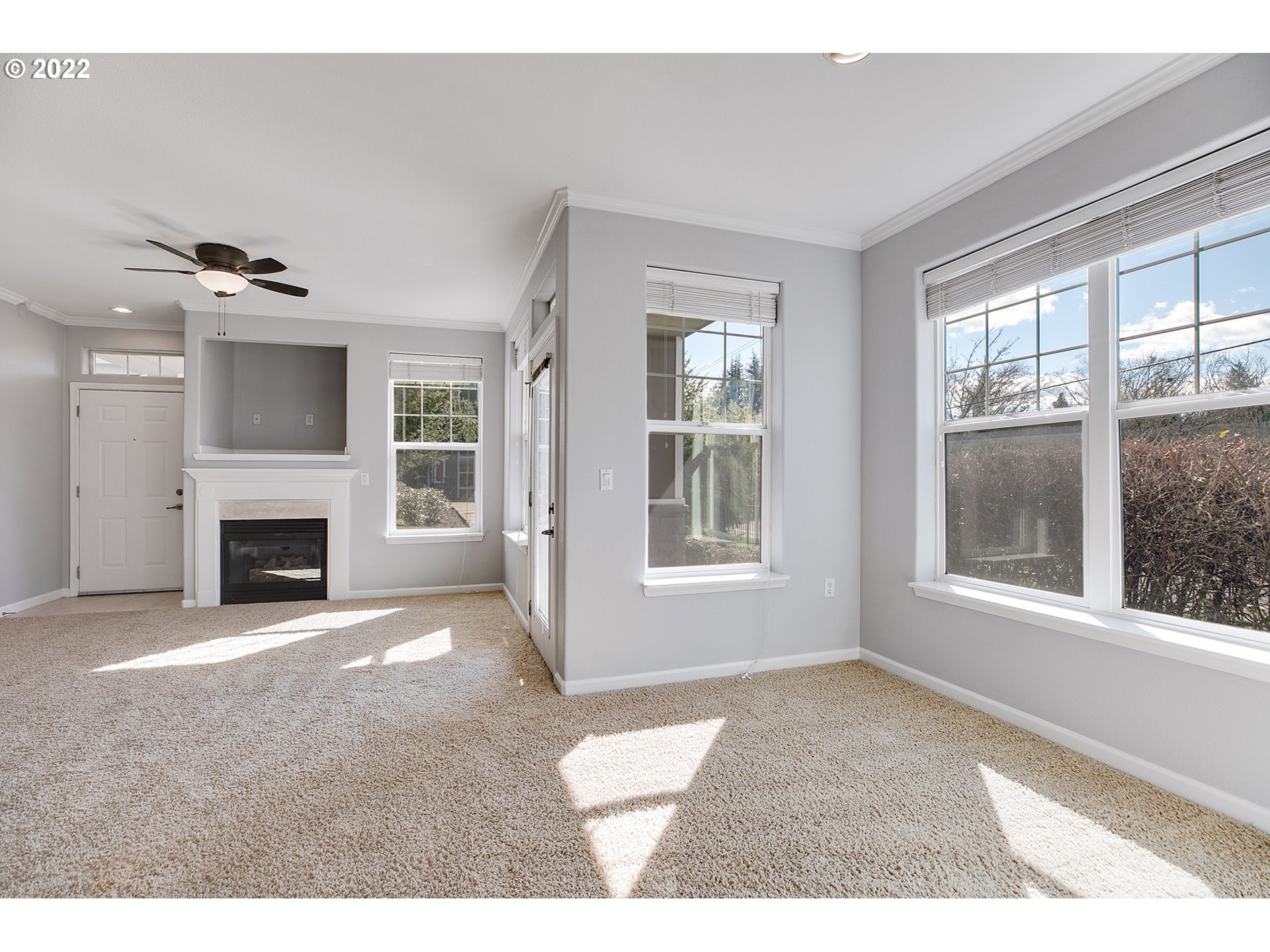 595 Springtree Lane West Linn, OR 97068 - Photo 5 of 28 a view of an empty room with a fireplace and a window