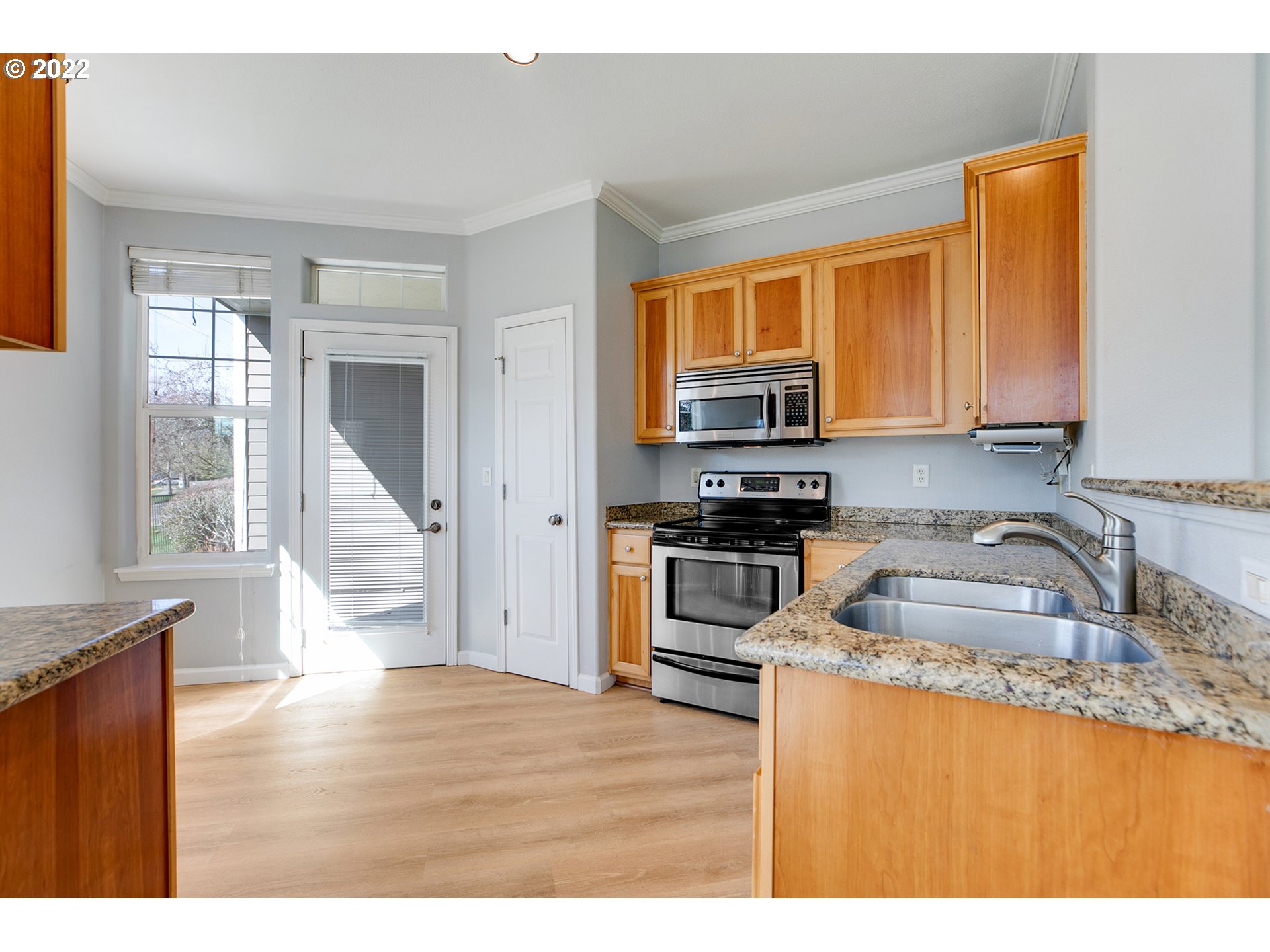 595 Springtree Lane West Linn, OR 97068 - Photo 9 of 28 a kitchen with stainless steel appliances granite countertop a sink a stove and a microwave