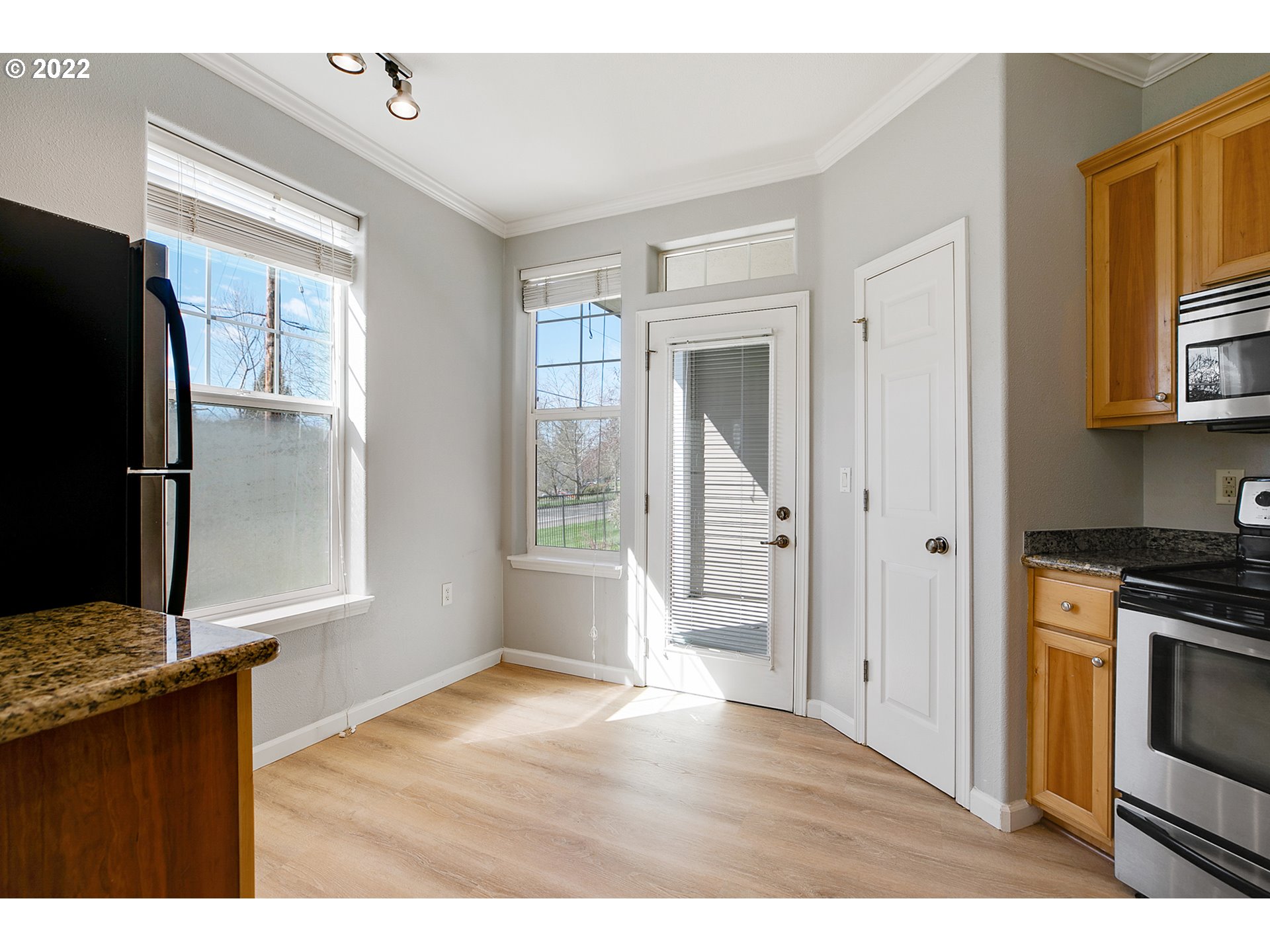 595 Springtree Lane West Linn, OR 97068 - Photo 10 of 28 a kitchen view with wooden floor electronic appliances and windows