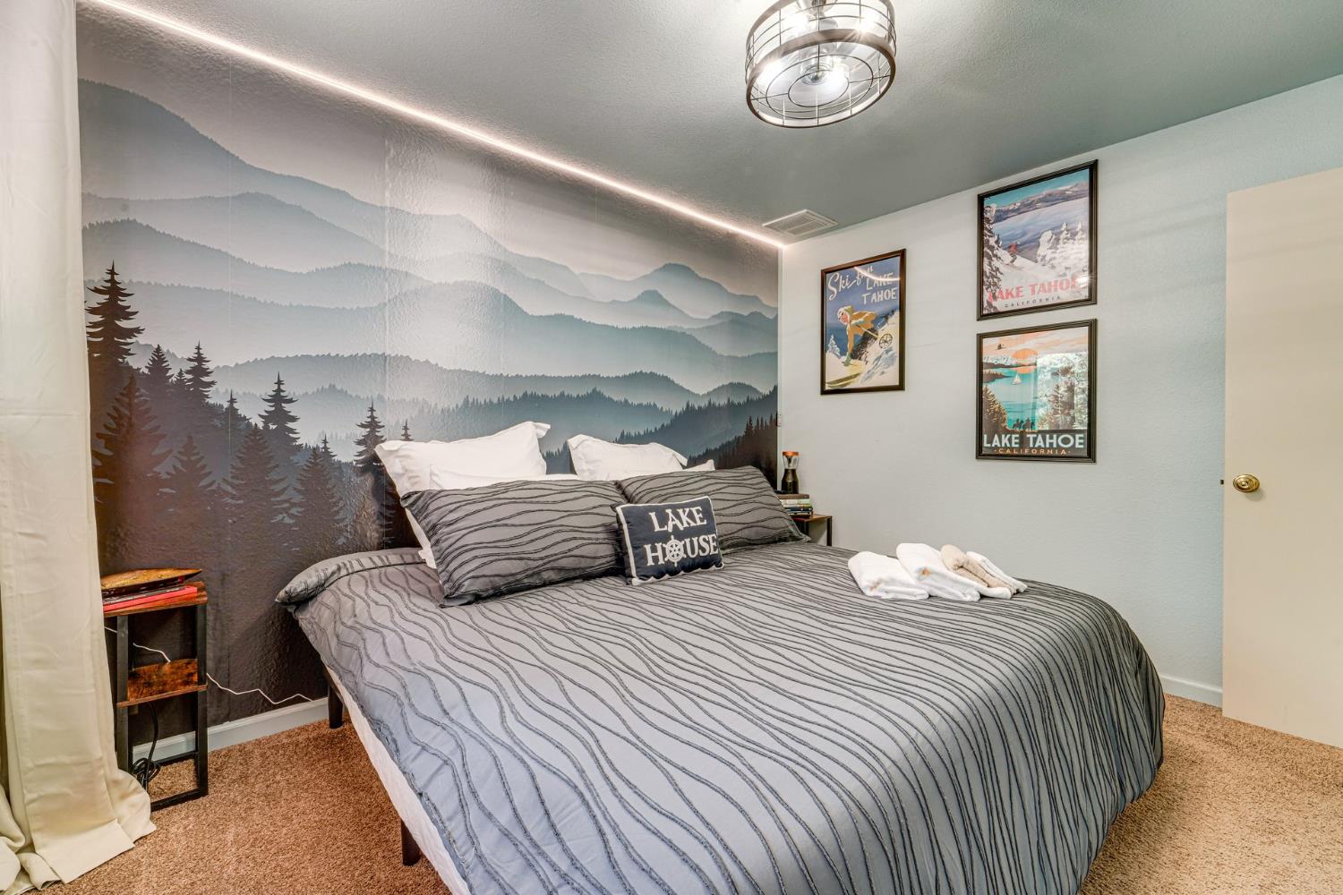 41080 Putt Road Alta, CA 95715 - Photo 11 of 17 a bedroom with bed and a chandelier