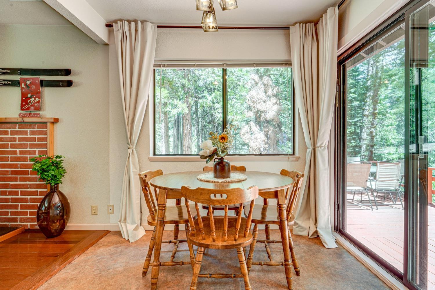 41080 Putt Road Alta, CA 95715 - Photo 13 of 17 a dining room with furniture window wooden floor and garden view