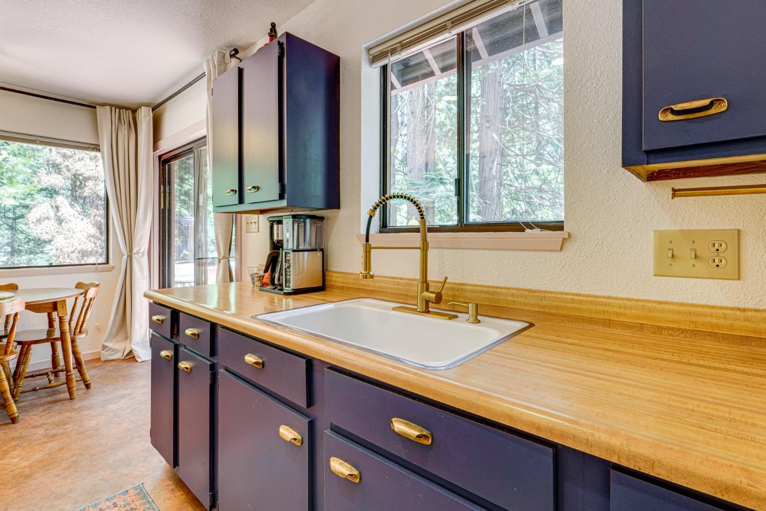 41080 Putt Road Alta, CA 95715 - Photo 3 of 17 a bathroom with a sink and a large mirror next to a window