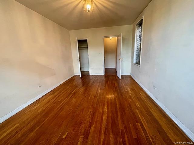 48-21 40th Street, Unit 2C Queens, NY 11104 - Photo 4 of 7 a view of wooden floor in an empty room