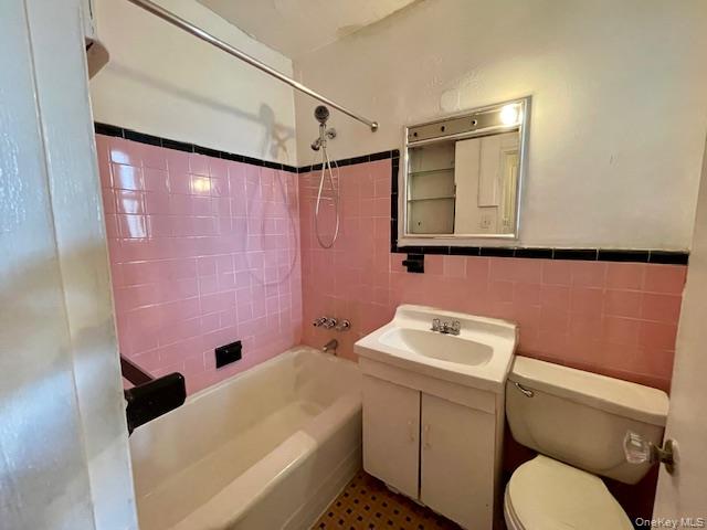 48-21 40th Street, Unit 2C Queens, NY 11104 - Photo 6 of 7 a bathroom with a sink toilet and shower