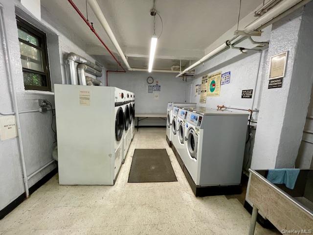 48-21 40th Street, Unit 2C Queens, NY 11104 - Photo 7 of 7 a utility room with dryer and washer