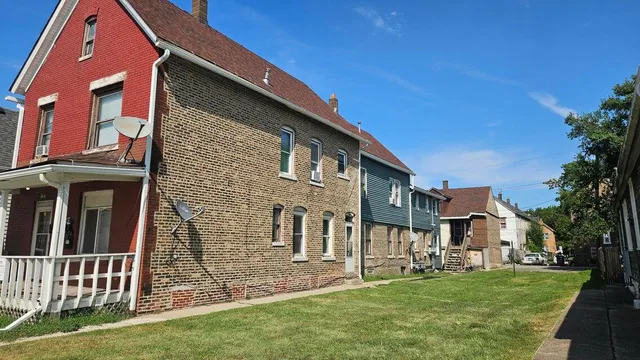 a kitchen with sink stove and refrigerator