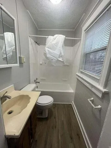a view of kitchen and wooden floor