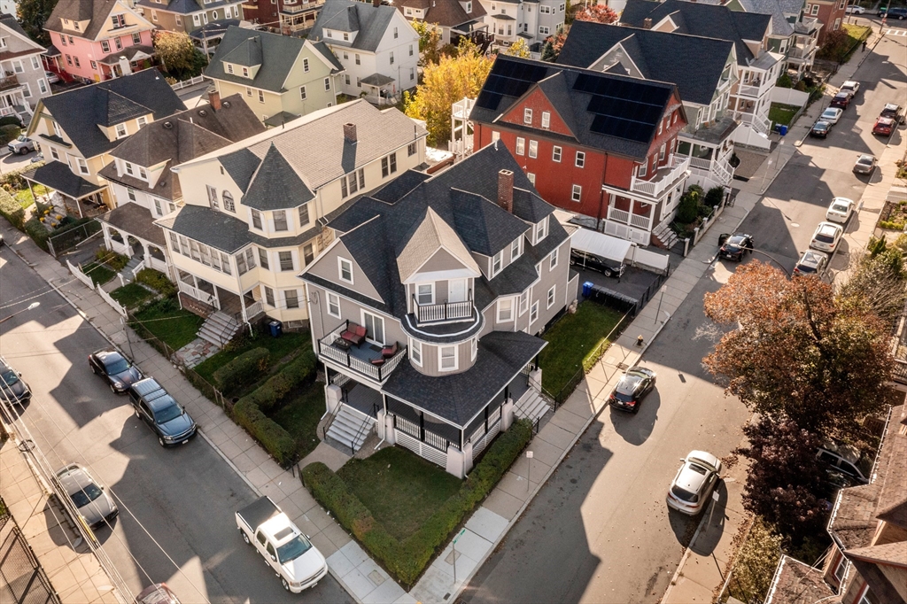 an aerial view of a house with a ocean view