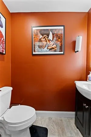 a bathroom with a toilet and a sink