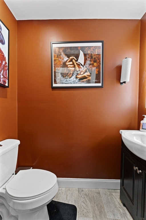 69 Greenwood Street Boston, MA 02121 - Photo 14 of 42 a bathroom with a toilet and a sink