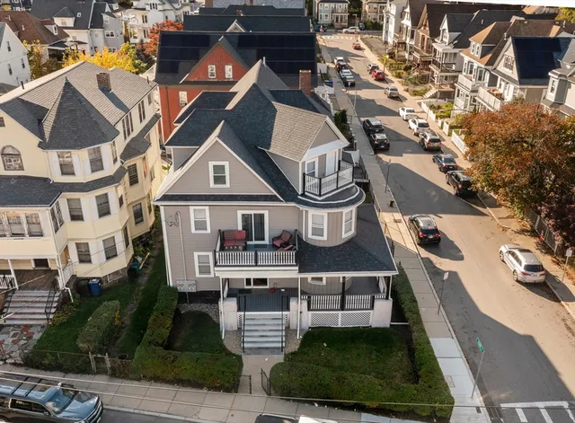 a aerial view of a house with a swimming pool