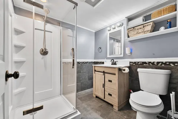 a kitchen with a table chairs refrigerator and microwave