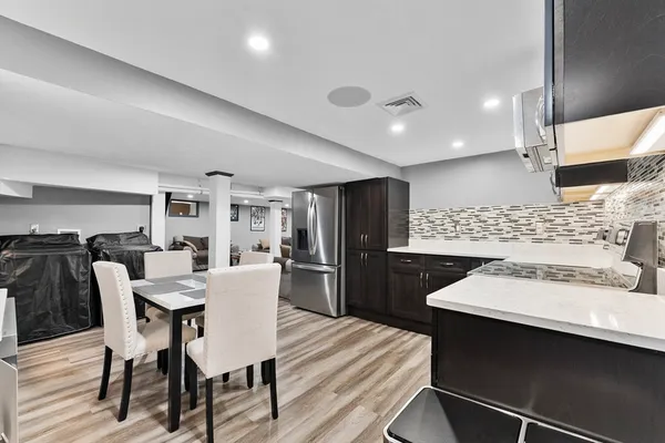 a kitchen with a stove and a refrigerator