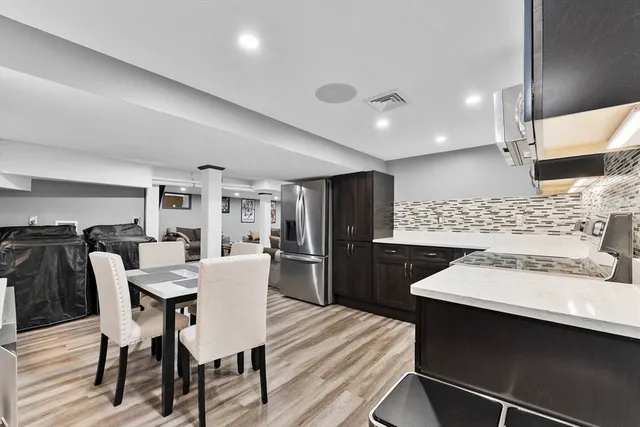 a kitchen with a stove and a refrigerator