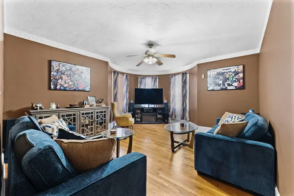 a living room with furniture and a flat screen tv
