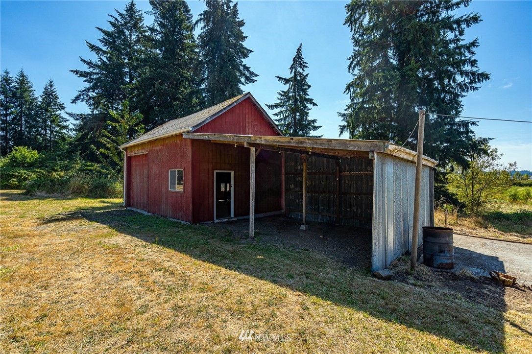 1458 Rush Road Chehalis, WA 98532 - Photo 20 of 40 a front view of a house with a yard and trees
