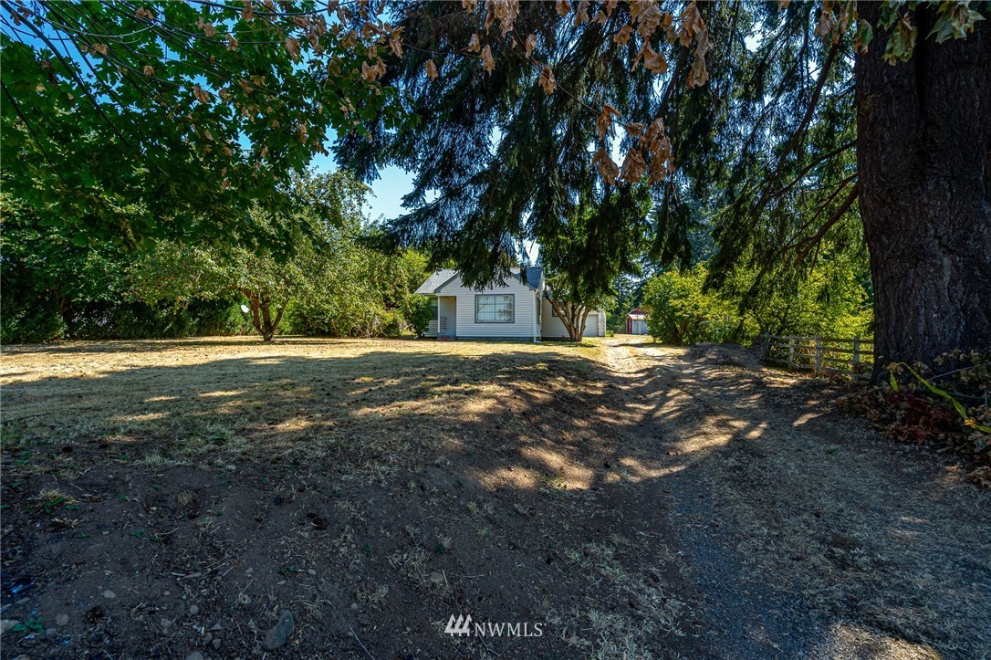 1458 Rush Road Chehalis, WA 98532 - Photo 3 of 40 a view of outdoor space with trees all around