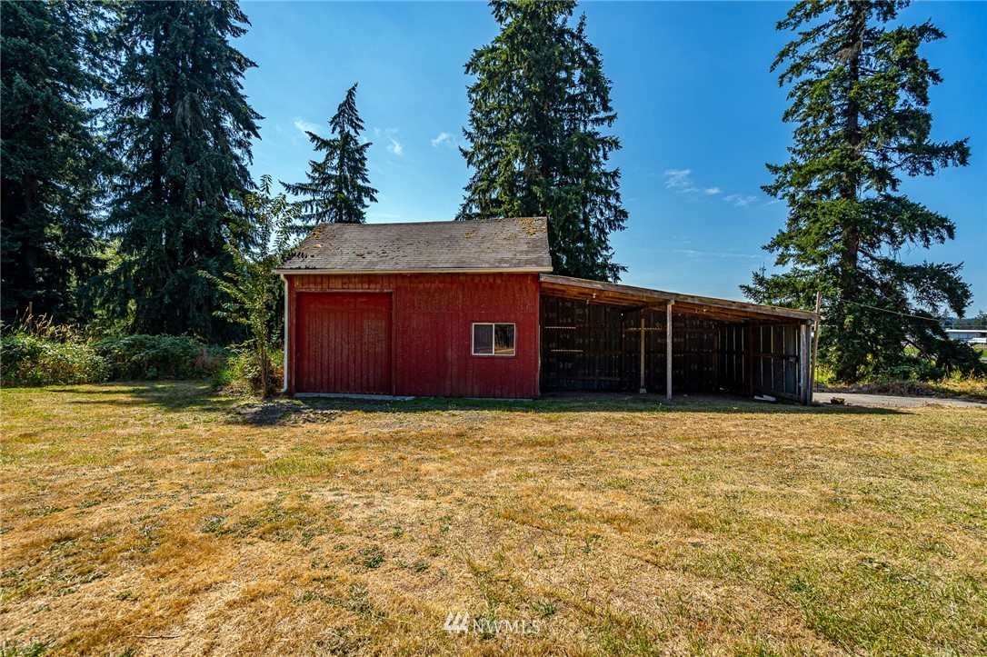 1458 Rush Road Chehalis, WA 98532 - Photo 21 of 40 a house with trees in front of it