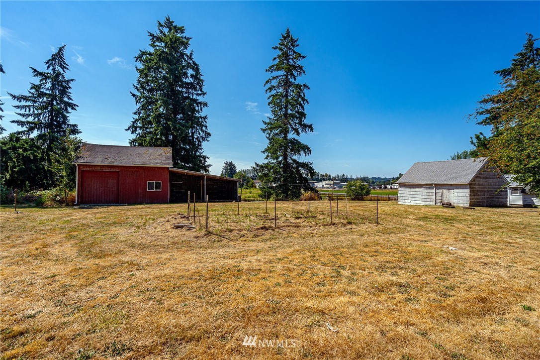 1458 Rush Road Chehalis, WA 98532 - Photo 22 of 40 a view of a house with a yard