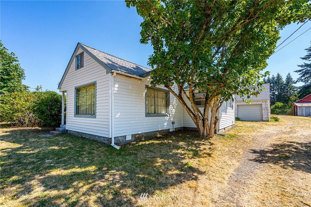 1458 Rush Road Chehalis, WA 98532 - Photo 4 of 40 a view of a house with yard and a tree