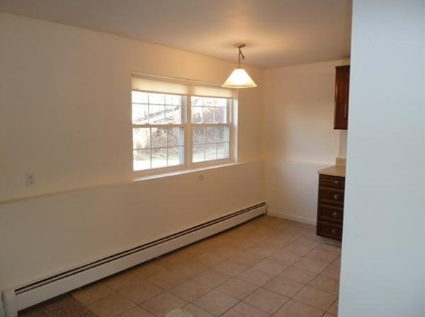 67 Fernview Avenue, Unit 2 North Andover, MA 01845 - Photo 4 of 8 an empty room with window