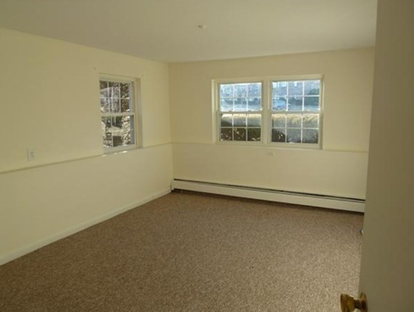 67 Fernview Avenue, Unit 2 North Andover, MA 01845 - Photo 5 of 8 an empty room with a window