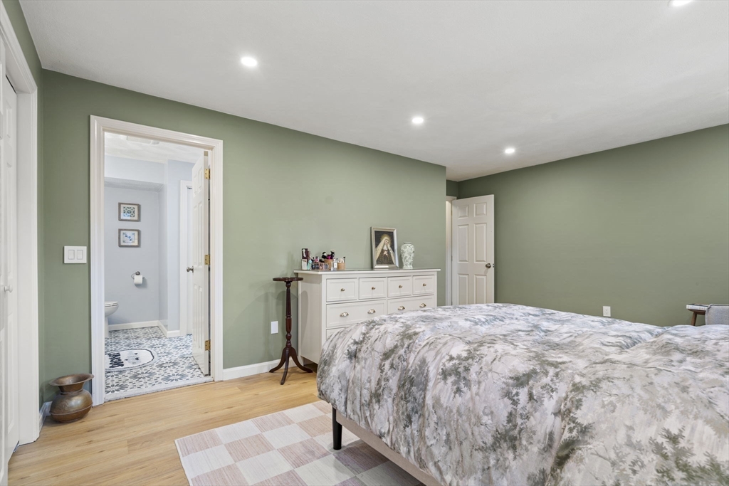4 Apple Ridge Road, Unit 6 Maynard, MA 01754 - Photo 14 of 40 a spacious bedroom with a bed and a dresser