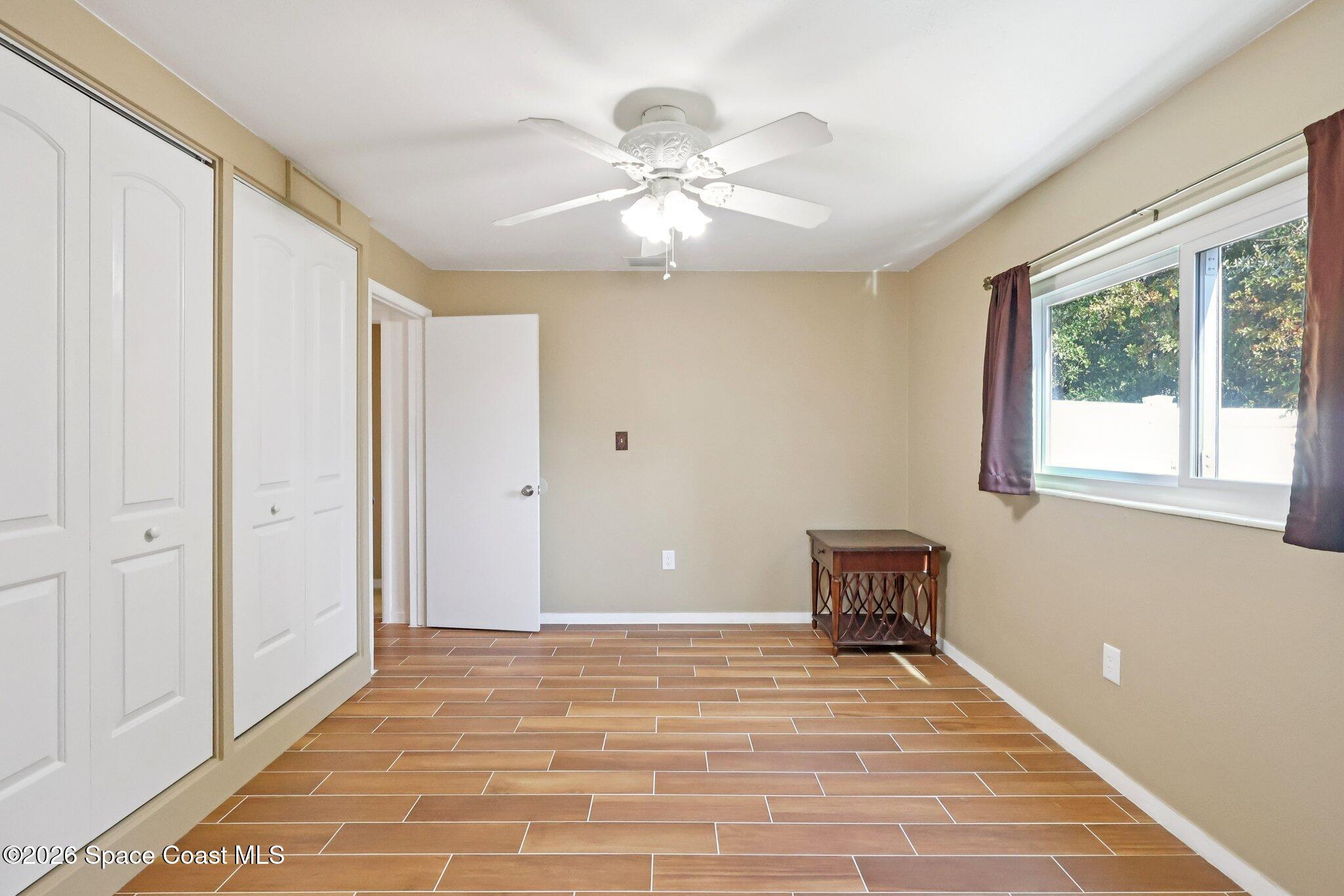 1945 Madison Avenue Melbourne, FL 32935 - Photo 19 of 33 a view of a livingroom with a ceiling fan and window