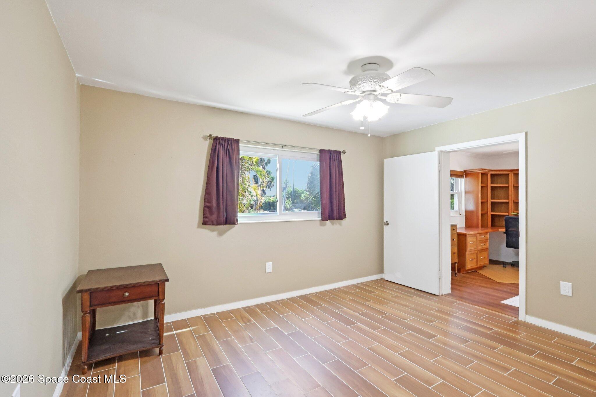1945 Madison Avenue Melbourne, FL 32935 - Photo 21 of 33 a view of room with hardwood floor and ceiling fan