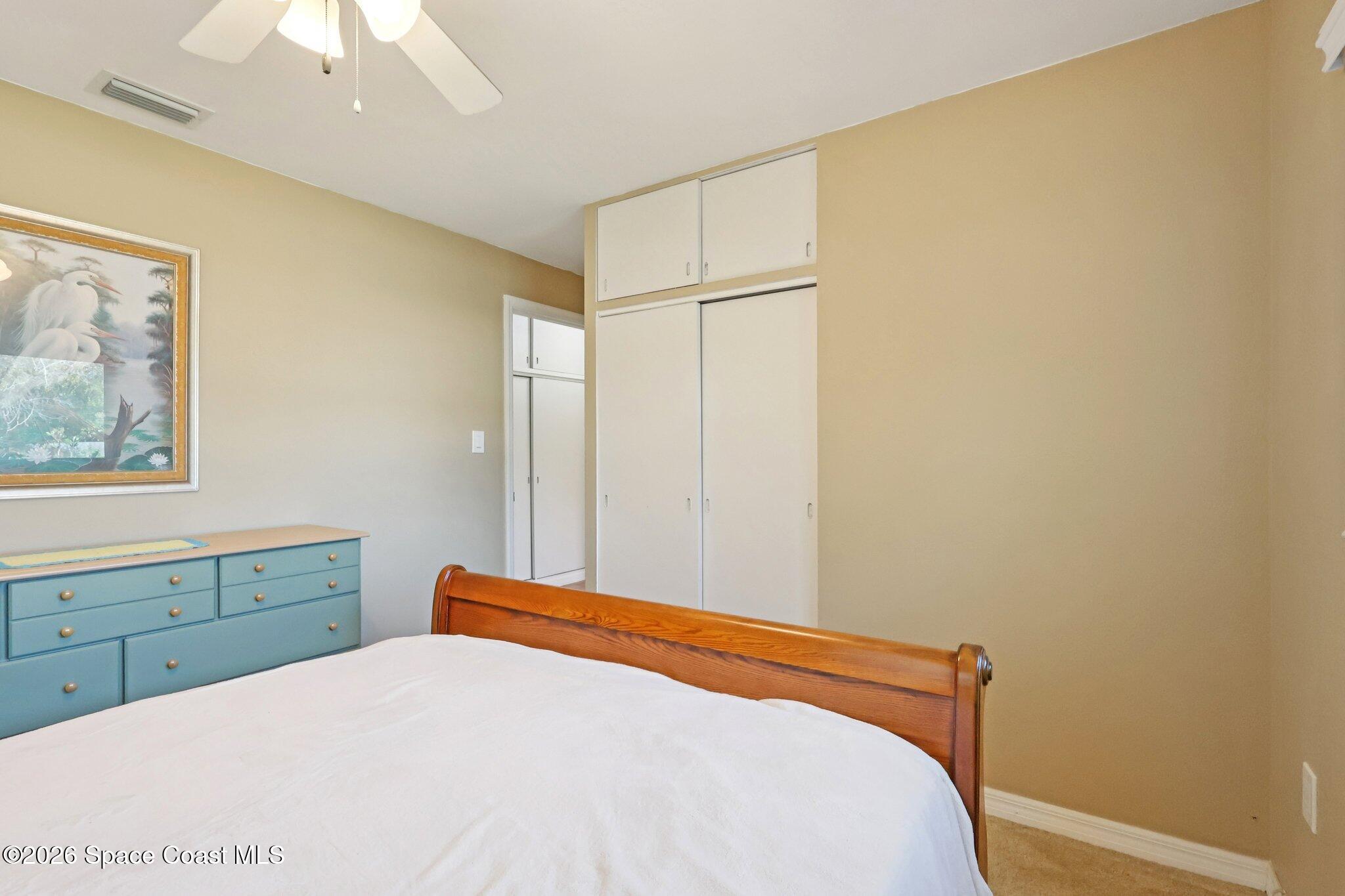 1945 Madison Avenue Melbourne, FL 32935 - Photo 23 of 33 a bedroom with a bed and a window