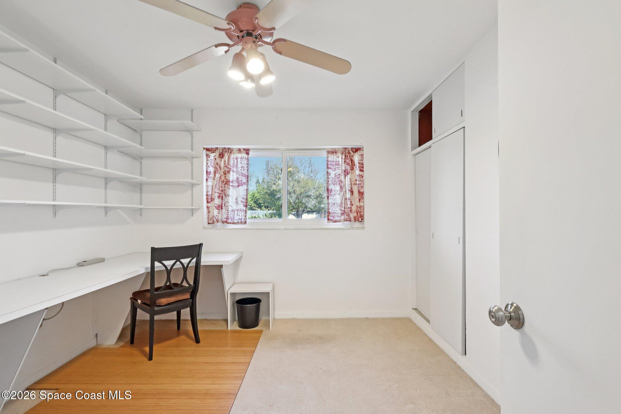 1945 Madison Avenue Melbourne, FL 32935 - Photo 24 of 33 a view of a livingroom with furniture and chandelier fan