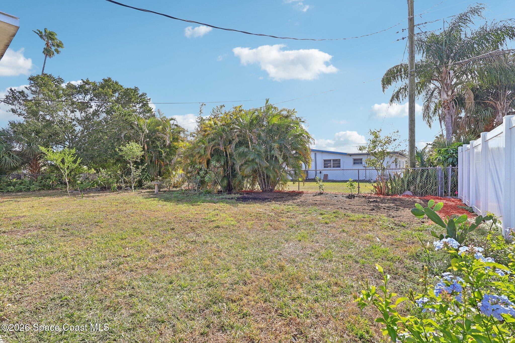 1945 Madison Avenue Melbourne, FL 32935 - Photo 29 of 33 a view of a yard with a house