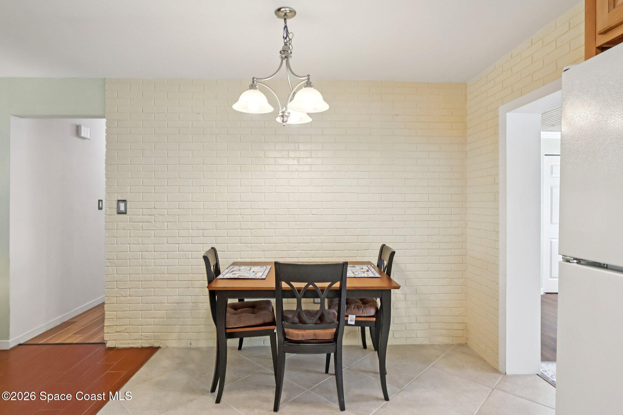 1945 Madison Avenue Melbourne, FL 32935 - Photo 4 of 33 a view of a dining room with furniture and chandelier