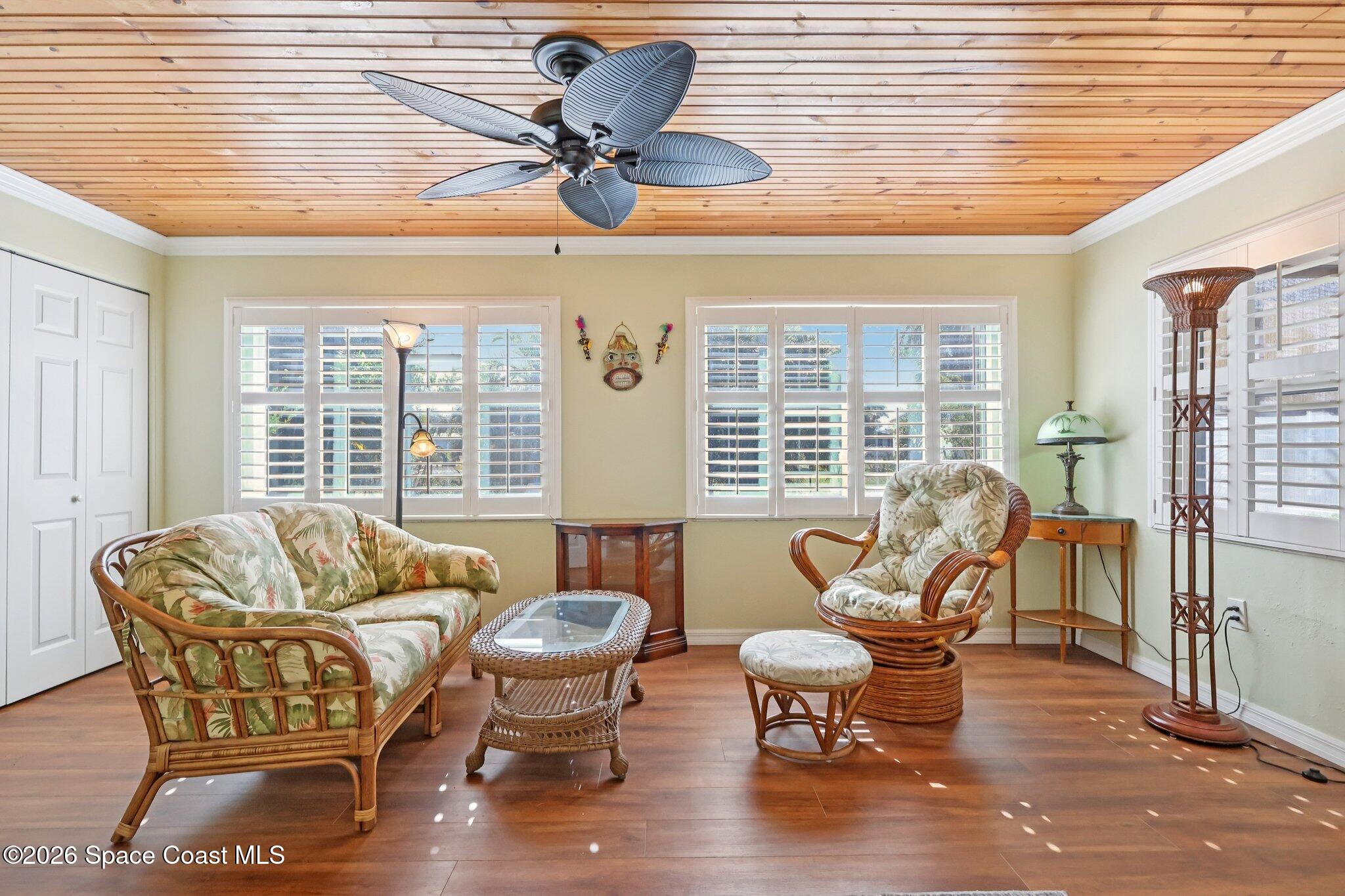 1945 Madison Avenue Melbourne, FL 32935 - Photo 5 of 33 a living room with furniture and floor to ceiling windows