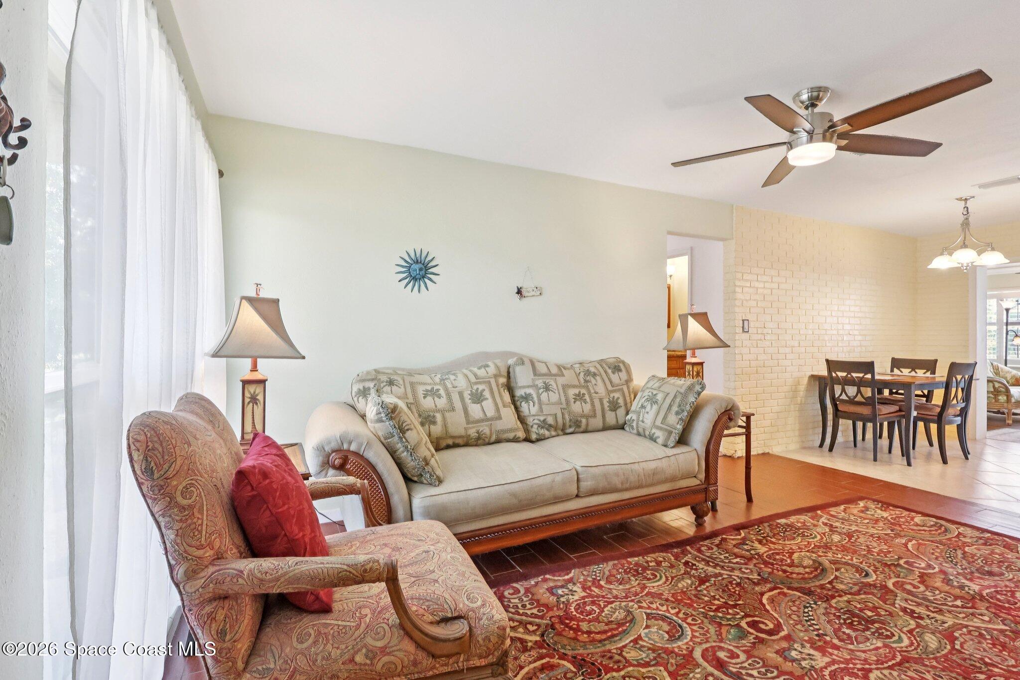 1945 Madison Avenue Melbourne, FL 32935 - Photo 9 of 33 a living room with furniture and a rug
