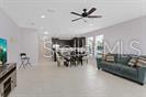 7601 Ripplepointe Way Windermere, FL 34786 - Photo 12 of 30 a view of a livingroom with furniture and a chandelier fan