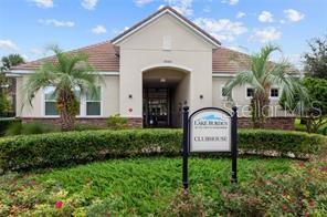 7601 Ripplepointe Way Windermere, FL 34786 - Photo 27 of 30 a view of a house with a small yard and a palm tree