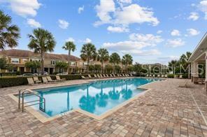 7601 Ripplepointe Way Windermere, FL 34786 - Photo 30 of 30 a view of swimming pool with outdoor seating and plants