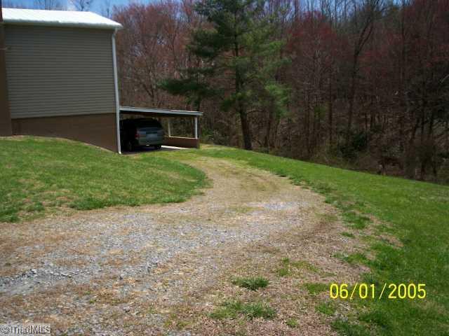 131 Lowe Road Mount Airy, NC 27030 - Photo 13 of 13 Exterior Back. Back view of home showing carport.
