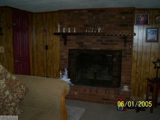 131 Lowe Road Mount Airy, NC 27030 - Photo 5 of 13 Living Room. Wood burning Fireplace in Living Room