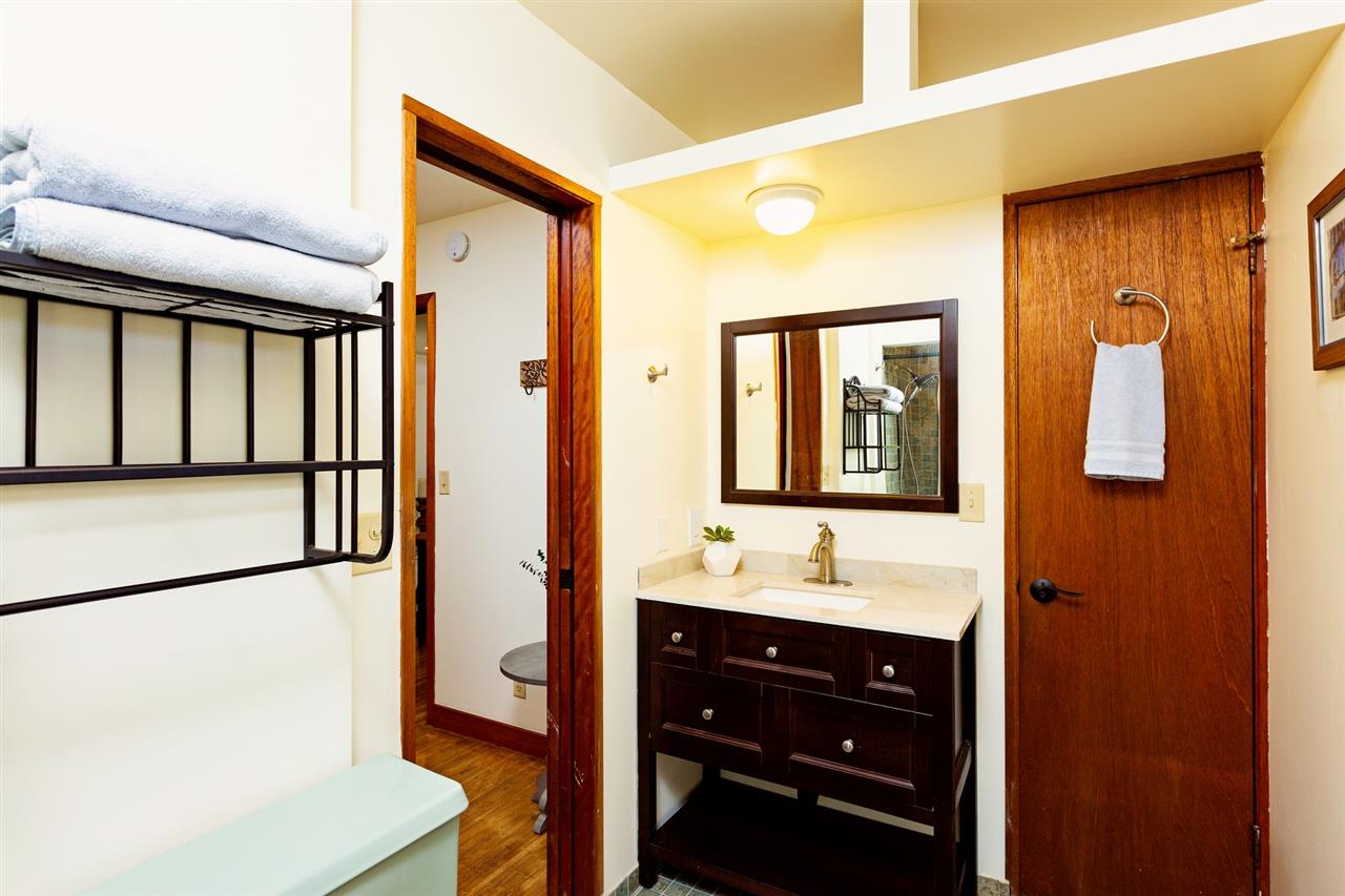 718 Holopuni Road Kula, HI 96790 - Photo 14 of 21 a bathroom with a sink a mirror and a shower