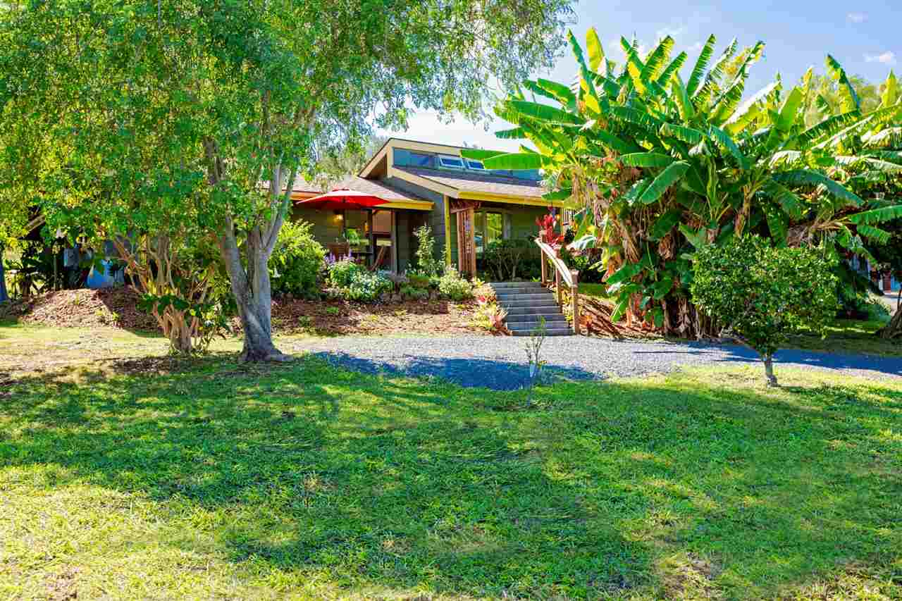 718 Holopuni Road Kula, HI 96790 - Photo 3 of 21 a backyard of a house with yard and outdoor seating